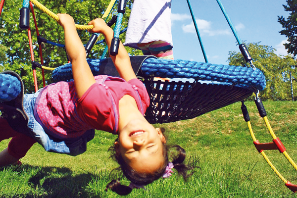 Girl Hanging On Spiral Carousel