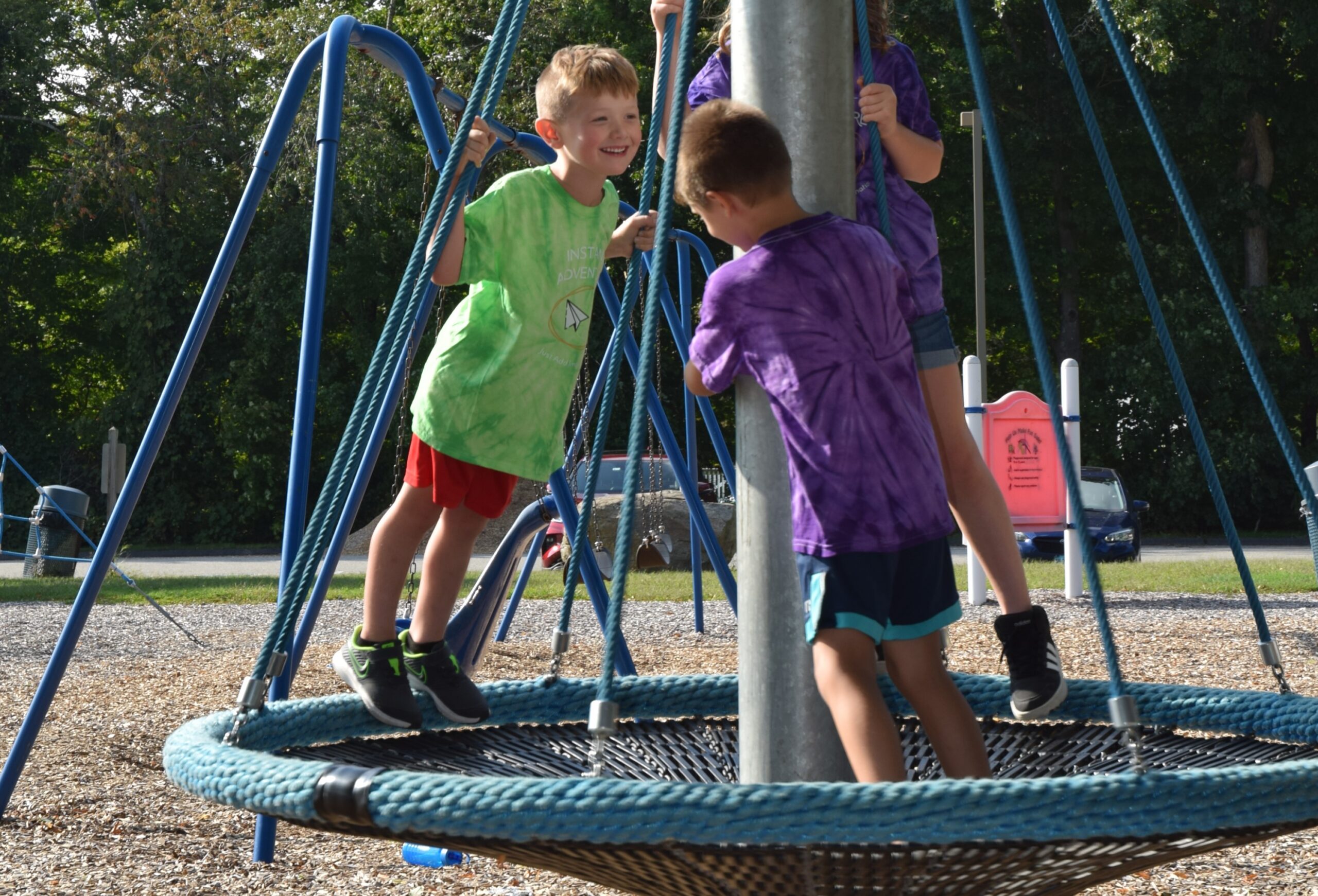 Boys playing on Spinner