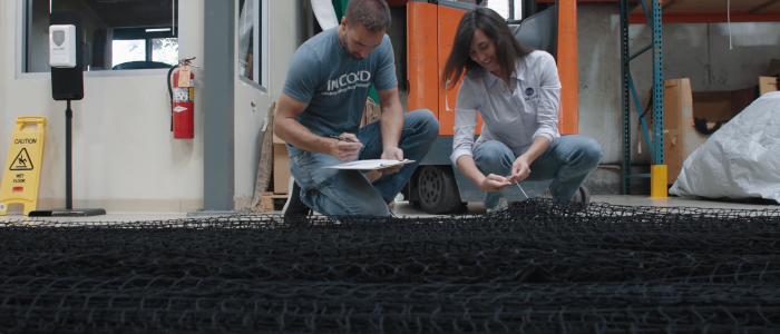 Two InCord workers inspect their netting product for quality